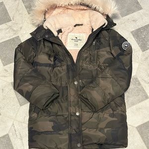 Abercrombie kids camouflage winter jacket with pink fur lining.